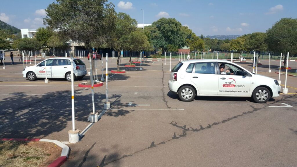 My Driving School branded vehicles at a driver evaluation practice yard in Pretoria